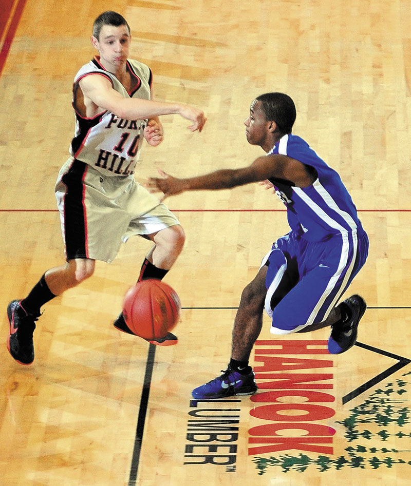 A SHOT AT GOLD: Brandon Ouellette, left, and the Forest Hills boys basketball team will take on Central Aroostook in the Class D state championship game at 2:45 p.m. today at the Bangor Auditorium.