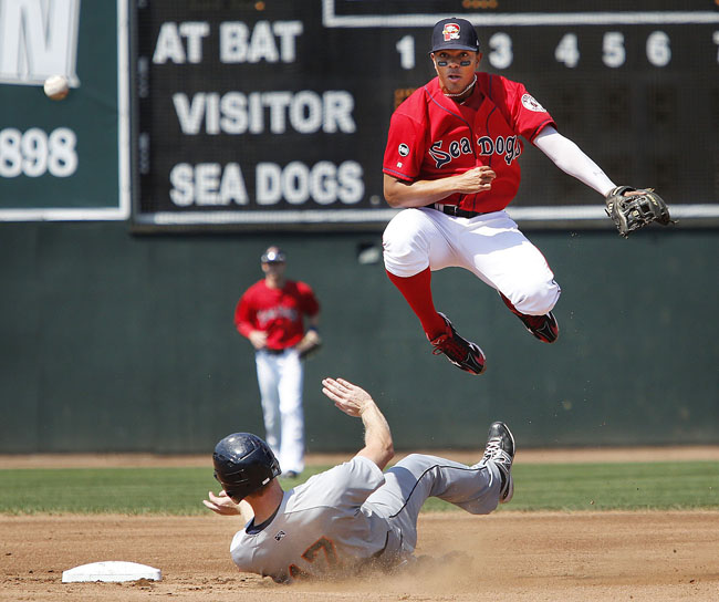 Xander Bogaerts of Portland makes the throw for a double play on August 26, 2012, after forcing out Dustin Martin during the second inning of a home game against Binghampton. Bogaerts, who played 23 games for Portland at the end of last season, batting .326, returns this year.