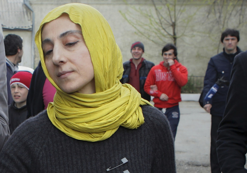 Zubeidat Tsarnaeva, mother of Tamerlan and Dzhokhar Tsarnaev, the two men accused of setting off bombs near the Boston Marathon finish line on April 15 in Boston, walks near her home in Makhachkala, Dagestan, in southern Russia, on Tuesday.