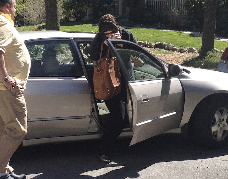 In this Sunday, April 21, 2013 photo, Katherine Russell Tsarnaev, center, wife of killed Boston Marathon bombing suspect Tamerlan Tsarnaev, exits a car at the home of her parents in North Kingstown, R.I. At left is her father, Warren Russell. Federal authorities have asked to speak with her, and her lawyer said he is discussing with them how to proceed. (AP Photo/Katie Zezima) Boston Marathon Bombing Tsarnaev