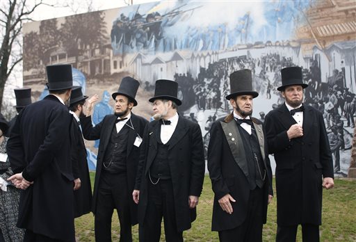 Members of the Association of Lincoln Presenters visit a Civil War mural on their way to the Ohio Statehouse on Friday in Columbus. They were going there to hear a Lincoln speech in the House chamber given by fellow presenter Jerry Payn.