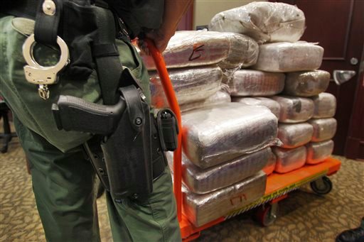 Bales of marijuana are wheeled out at a news conference in Jonesboro, Ga., in 2010, when 45 people were arrested and cash, guns and more than two tons of drugs were seized as part of an investigation by federal and local law enforcement into the Atlanta-area U.S. distribution hub of Mexico’s La Familia drug cartel.