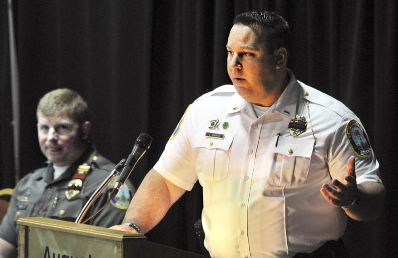 Staff photo by Andy Molloy FIRST RESPONDERS: Newtown, CT, Police Lt. Christopher Vanghele, right, and Officer Jeff Silver discuss responding to the Sandy Hook Elementary School during the December 2012 shooting that claimed the lives of 20 children and six adults during a conference in Augusta on Tuesday April 23, 2013.