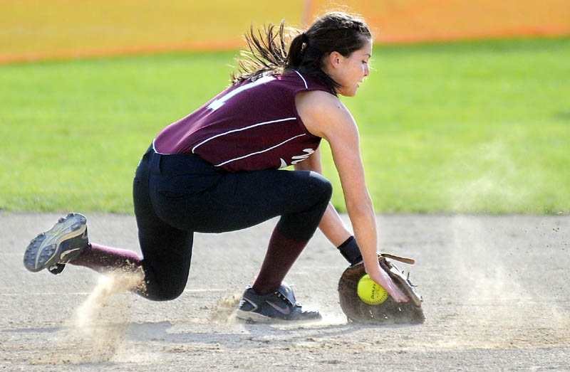 NICE SCOOP: Nokomis Regional High School’s Lacey Kent-Webber grabs a ground ball during a against Gardiner Area High School on Monday in Gardiner. The Tigers beat the Warriors 7-4.