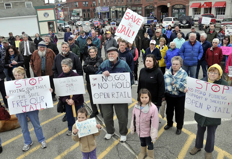 Protesters listen to Sheriff Scott Nichols Sr., speak during a protest at the Franklin County Courthouse over the Franklin County Jail's reduction to a 72-hour holding facility in Farmington on Wednesday.