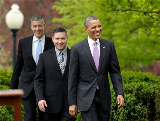 2013 National Teacher of the Year Jeff Charbonneau, center, follows President Barack Obama to the Rose Garden for a ceremony honoring Charbonneau. Education Secretary Arne Duncan at left.