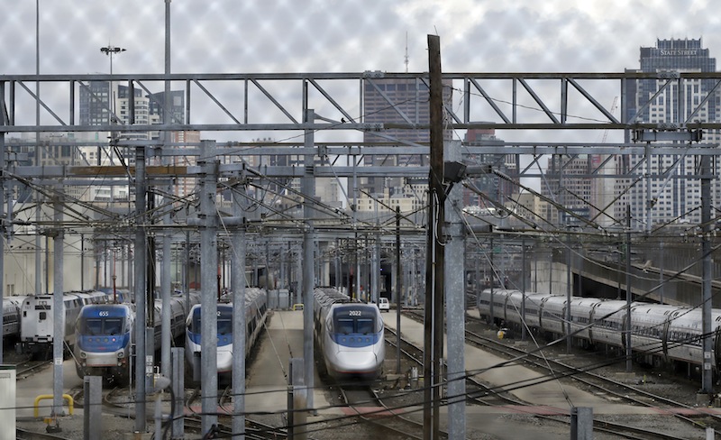 Amtrak trains sit idle in a train yard on the south side of Boston Friday, April 18, 2013 as all transit service remains shut down in the Boston area. Two suspects in the Boston Marathon bombing killed an MIT police officer, injured a transit officer in a firefight and threw explosive devices at police during their getaway attempt in a long night of violence that left one of them dead and another still at large Friday, authorities said as the manhunt intensified for a young man described as a dangerous terrorist. (AP Photo/Elise Amendola) BOSTON MARATHON EXPLOSIONS