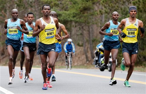 Elite mens marathoners, from left, Levy Matebo, Lelisa Desisa, Markos Geneti, Micah Kogo and Gebregziabher Gebremariam compete on the Boston Marathon course in Wellesley, Mass., Monday, April 15, 2013. (AP Photo/Michael Dwyer)