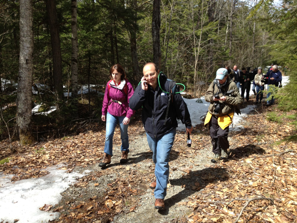 Journalists and neighbors leave the area leading to Christopher Knight's camp.