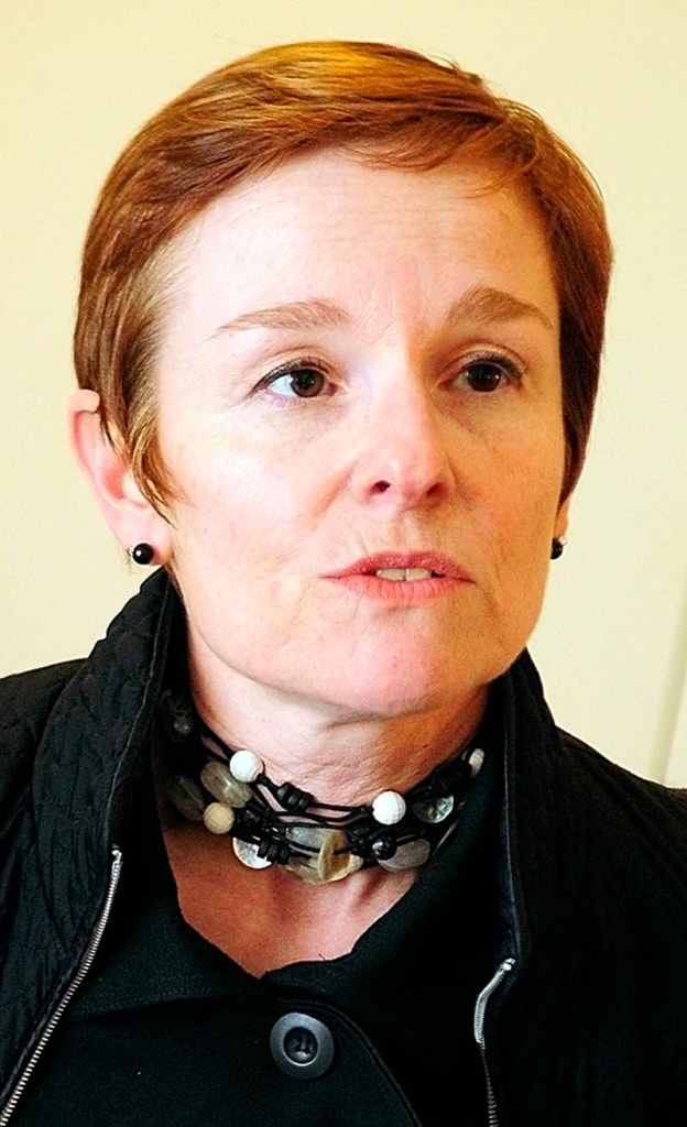 Patricia Rosi , the chief operating office of the Wellness Connection of Maine, answers questions during an interview outside the company's Hallowell dispensary on Friday.