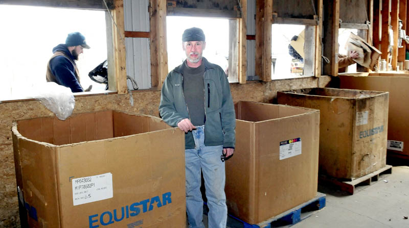 Facilities manager Aaron Paul stands in front of bins as residents drop off materials at the Unity Area Regional Recycling Center in Thorndike. Paul said the center has expanded the materials it accepts, and urged residents of the nine member communities to utilize the center.