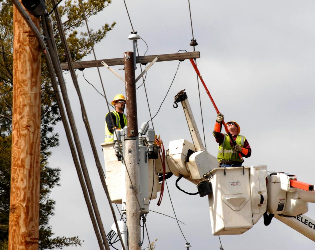 Central Maine Power Co. workers check out a transformer along Route 26 in Gray in March 2010. The company said as many as 5,100 job applicants who used their website may have had their personal information stolen by a hacker.
