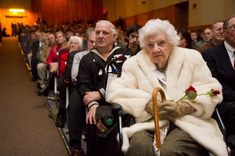 Carolyn Raddatz, right, cousin of a USS Thresher crew member, and her son Michael Raddatz listen during the 50th anniversary memorial ceremony Saturday.