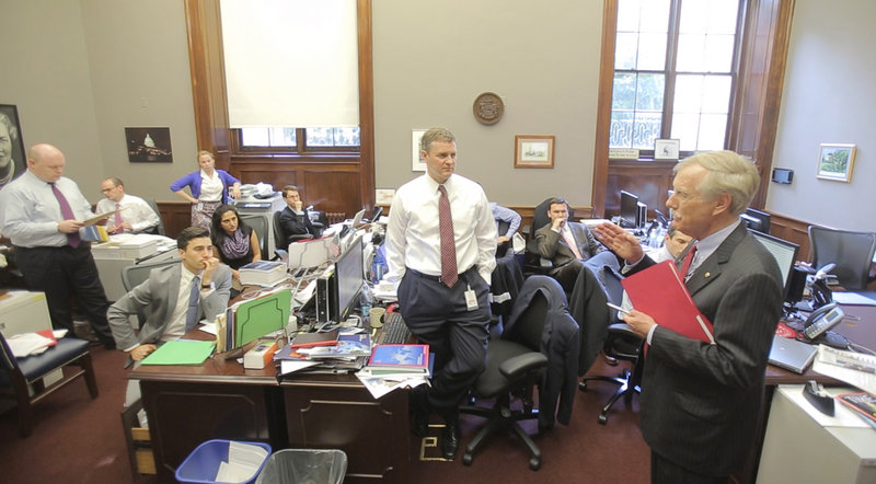 Sen. Angus King addresses members of his staff in their cramped, temporary office space in a basement room of the Russell Senate Office Building in Washington on Wednesday. The group of almost two dozen aides is hoping to move into bigger quarters by midsummer.