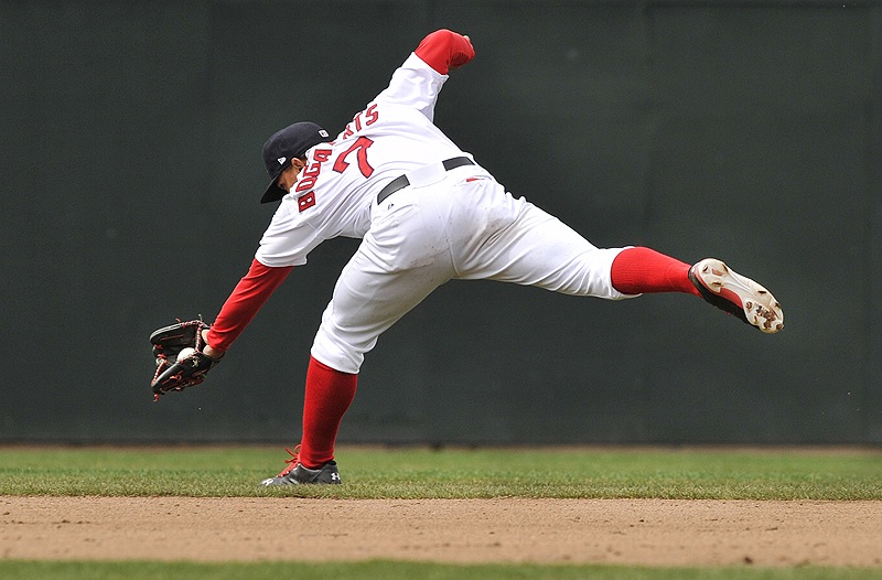 Xander Bogaerts of the Sea Dogs goes to his backhand in the shortstop hole to nab a grounder that went for an infield hit by Dan Rohlfing of New Britain at Hadlock Field.