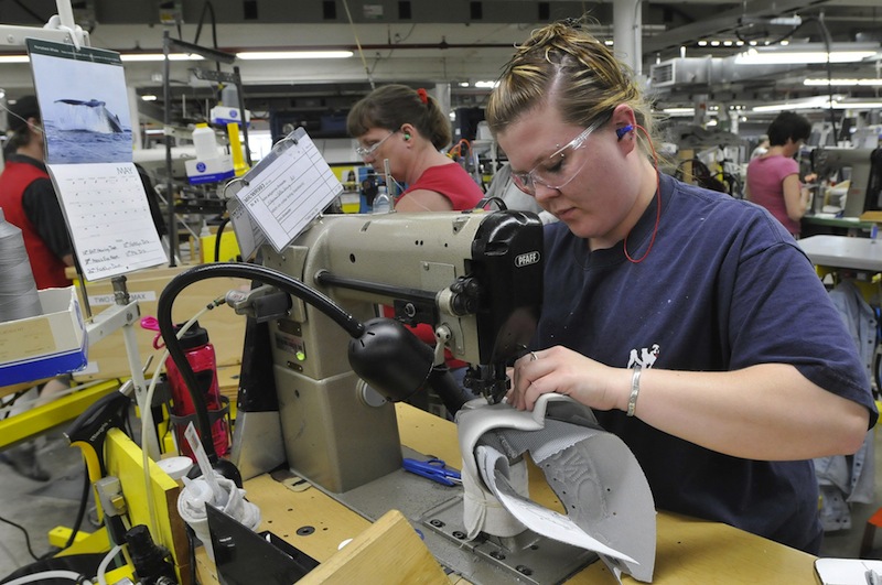 In this May 2011 file photo, Ashley Smith stitches shoes at New Balance in Norridgewock.