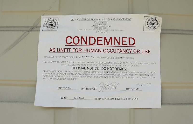 A sign marks a building condemned at 47 Knox Street in Lewiston Friday, May 10, 2013.