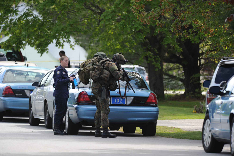 A member of the Maine State Police tactical unit joins dozens of state and local police officers in Saco during Saturday’s standoff.