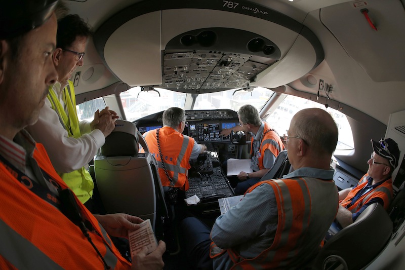 United Airlines employees learn about performing ground checks on flight a Boeing 787 Dreamliner aircraft from Houston, Texas, after it landed at Chicago's O'Hare International Airport Monday, May 20, 2013. The planes are returning after being grounded for four months by the federal government because of smoldering batteries on 787s owned by other airlines. (AP Photo/Charles Rex Arbogast)