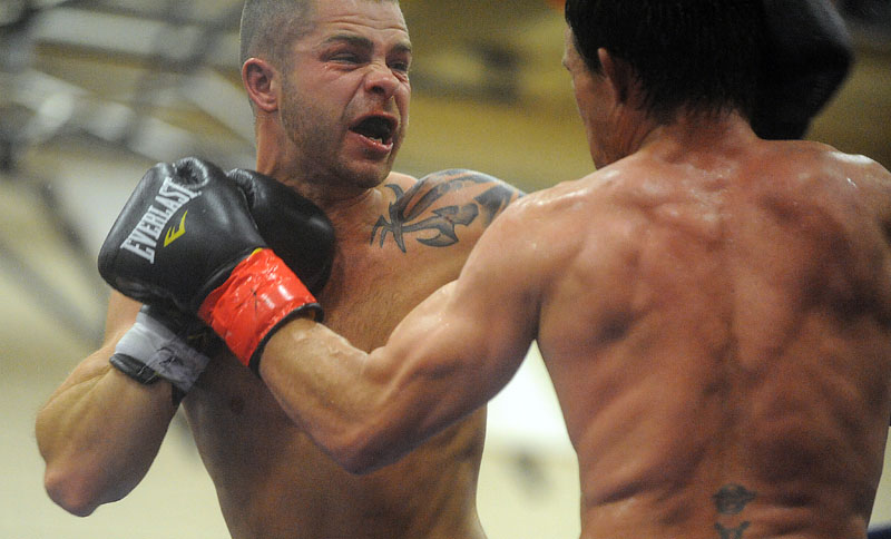 Brandon "The Cannon" Berry, left, fights Bill Jones in his professional boxing debut Saturday night at Skowhegan High School.