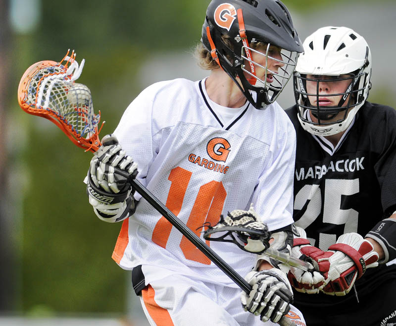 HERE I COME: Maranacook/Winthrop’s Zachary Godbout, right, defends Gardiner’s Josh Caldwell on Wednesday in Gardiner.