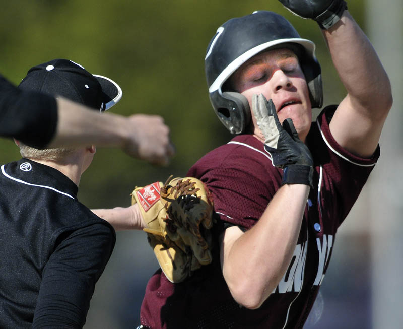 PICKED: Monmouth Academy’s Kyle Fletcher gets tagged out by Hall-Dale High School’s Nat Crocker during the Mustangs’ 8-2 win on Wednesday in Farmingdale.