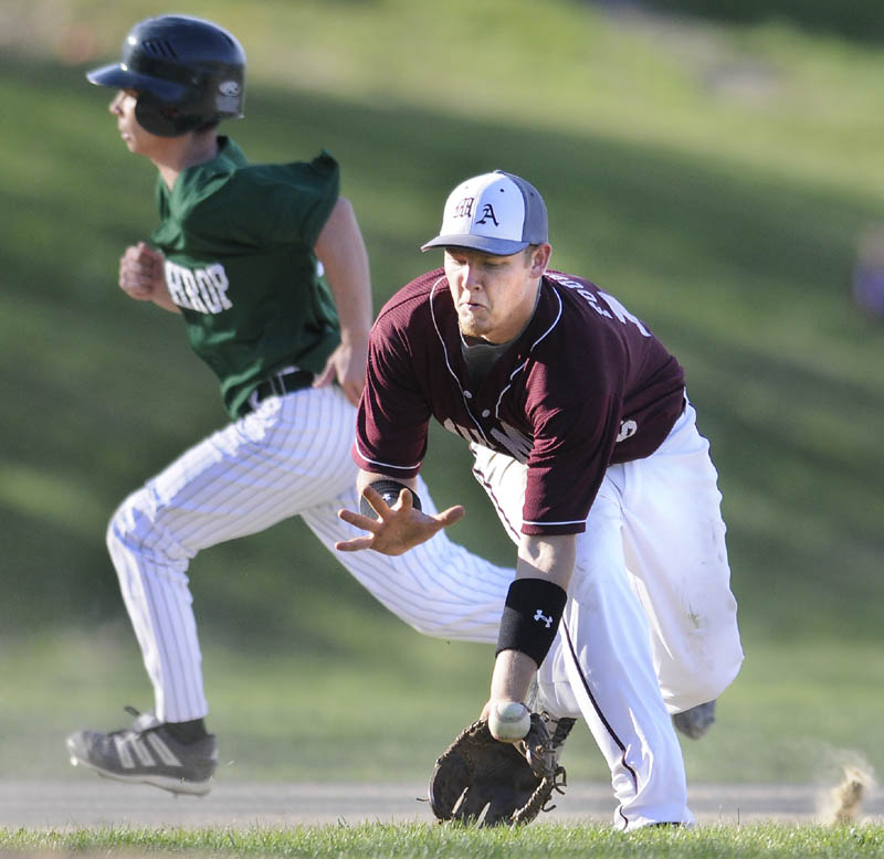 GOOD GRAB: Monmouth’s Josh Fournier fields a grounder at third base against Winthrop on Monday in Monmouth.