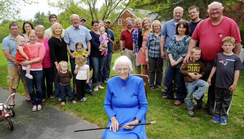 Priscilla Stevenson, 95, is surrounded by three generations of her children outside her Wayne home, after she received the Wayne Cane Sunday, given to the town's oldest resident.