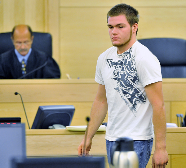 Kyle Dube walks into Superior Court for his arraignment at the Penobscot Judicial Center in Bangor on Wednesday.