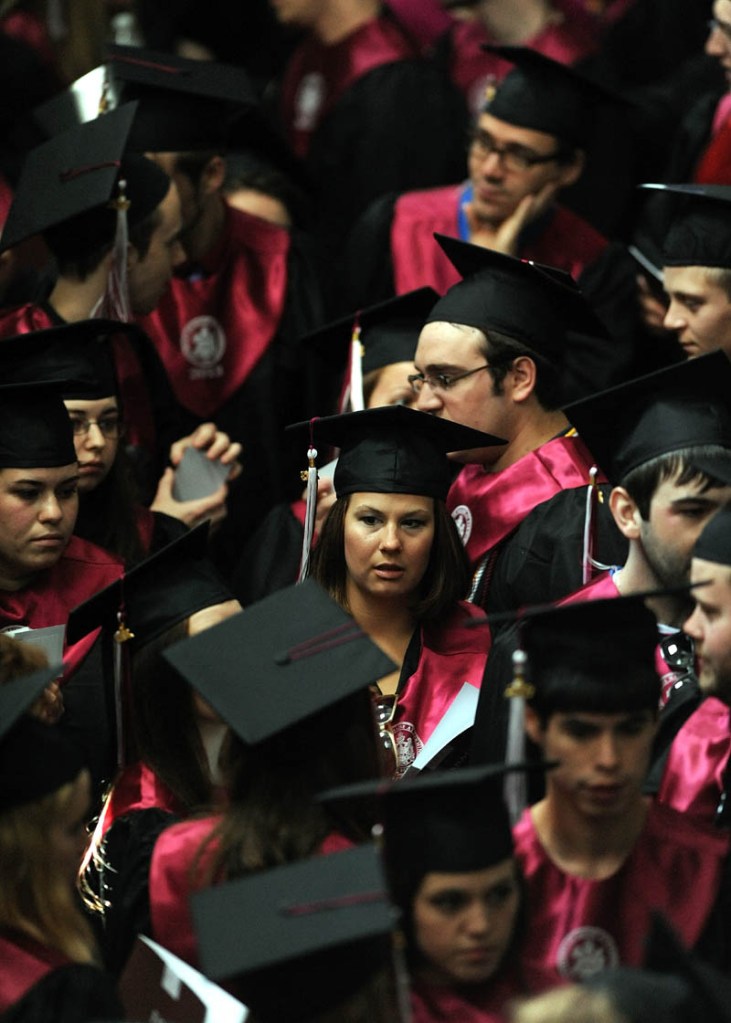 Graduates of the University of Maine at Farmington wait for commencement ceremonies to begin in Farmington on Saturday.