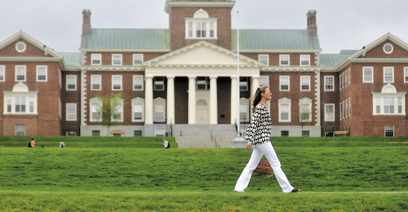 Gina Colombatto, 57, of Waterville, walks along Mayflower Hill Road at Colby College enroute to a friend's home on Thursday. Colombatto has traded in her automobile for walking shoes.