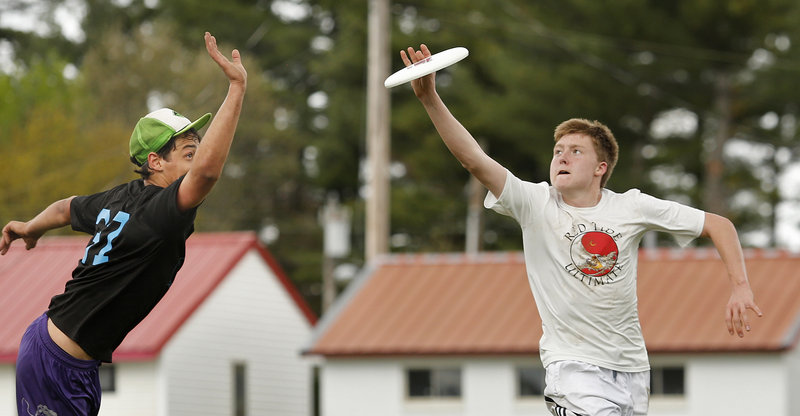 Aidan Black of Cumberland Ultimate scores after beating Samuel Astrachan of Casco Bay Black Mambas on Sunday, May 12, 2013.