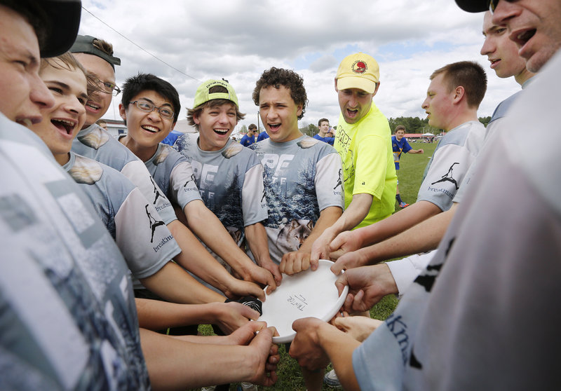 The Cape Elizabeth ultimate high school team comes together for a cheer before the start of the second half of their game against Falmouth on Sunday, May 12, 2013.