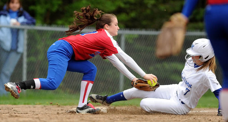 SLIDE INTO THIRD: Madison’s Kirstin Wood slides under the tag of Oak Hill third baseman Sadie Goulet on a stolen base attempt during the Bulldogs’ 5-3 win Wednesday in Madison.