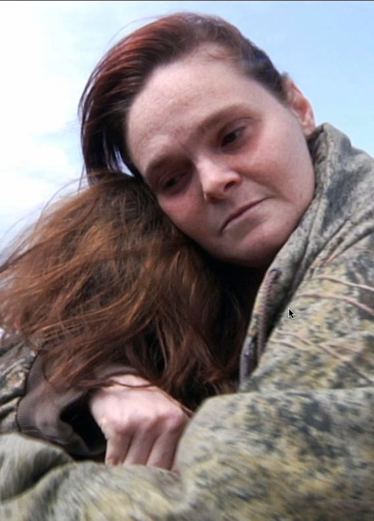 Amy Sharp hugs daughter Jenna Dunn, 10, a day after she picked up her children from Plaza Towers Elementary School in Moore, Okla., which was leveled by a tornado packing winds of up to 200 mph. on Tuesday, May 21, 2013, in Moore, Okla. (AP Photo/Peter Banda)