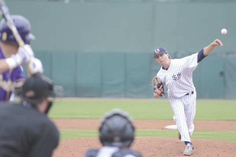 STILL ALIVE: Tyler Leavitt delivers a pitch during the ninth inning of University of Southern Maine’s 8-1 wn over the University of Wisconsin Stevens Point during the Division III College Baseball World Series on Monday at in Appleton, Wis.