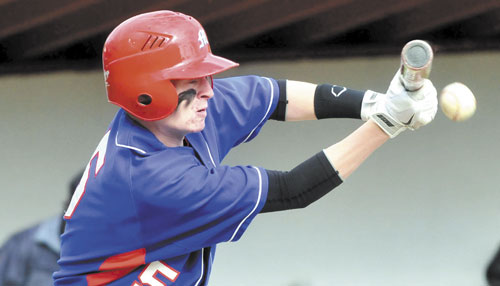 EYE ON THE BALL: Messalonskee’s Trevor Gettig bunts against Skowhegan on Monday in Skowhegan.