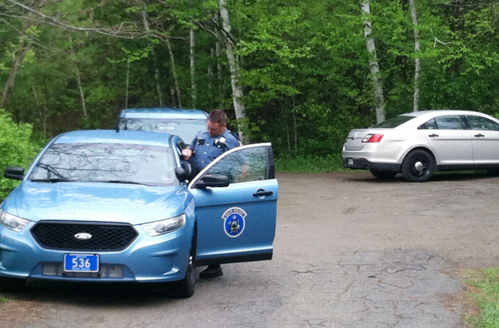 Maine State Police block a road alongside the Stillwater River on Tuesday where authorities found a girl's body believed to be that of Nichole Cable of Glenburn.