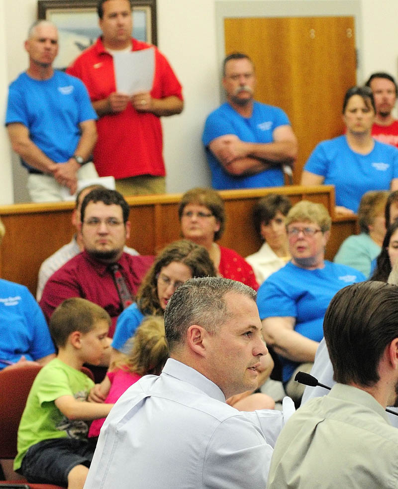 Councilor Jeffrey Bilodeau speaks to a standing room only crowd during a city council budget wrap-up meeting on Thursday in Augusta City Center.