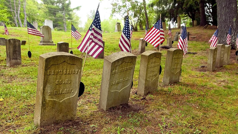 American flags fly over the graves of Civil War soldiers on Friday in Chelsea's Riverside Cemetery.