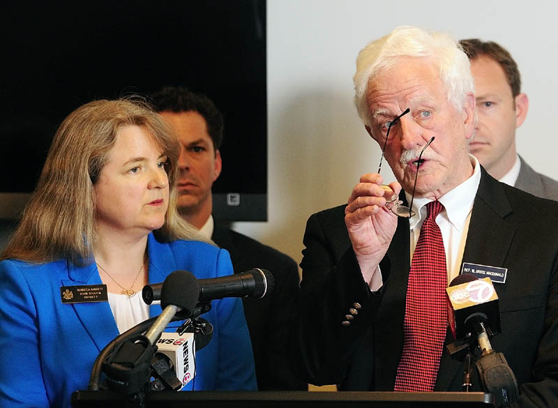 The co-chairs of the Legislature's Education Committee - Sen. Rebecca Millett, D-Cape Elizabeth, left, and Rep. Bruce MacDonald, D-Boothbay introduce a Democratic plan to grade schools during a news conference on Wednesday at the State House.