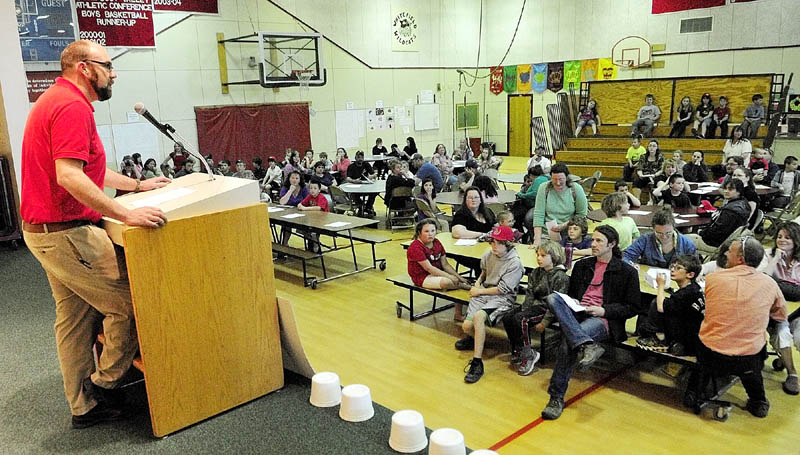 Principal Joshua McNaughton gives opening remarks during the Education Celebration on Friday at Whitefield Elementary School. There were activities for parents and students in each of the classrooms, along with a dinner. The school's parent-teacher association held a silent auction as a fundraiser for new playground equipment at the school.