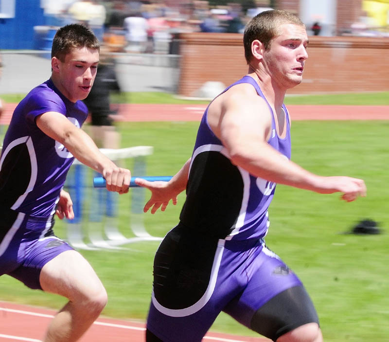 Waterville's Nick Stowe, left, hands off baton to teammate Nick Danner for final leg of 4x100 meters relay during the KVAC track meet on Monday May 27, 2013 in Bath.