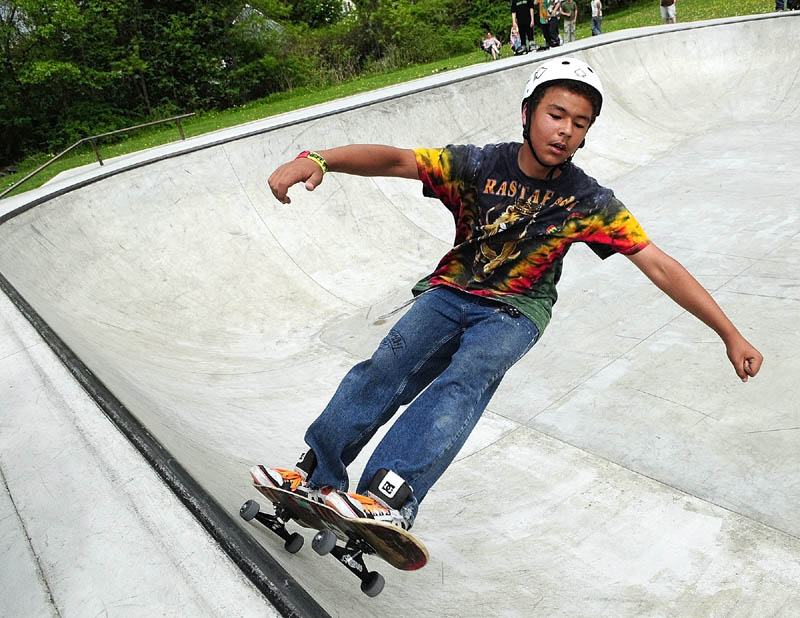 Chris "Flyin' Hawaiian" Thompson, of Windsor, rides in the bowl in the Augusta Skate Park during the Maine Sk8 Series Jam on Saturday, in Augusta. The park is in Williams playground near Bangor and Quimby Streets. The event was put on by the Gould Academy skateboarding program, and was the sixth of seven stops on the series' visits to skate parks across the state.