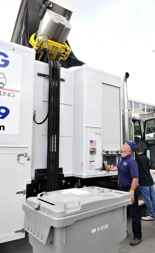 Craig Lefebvre, owner of Shredding On Site, operates a lift to transport documents into a truck outside Inland Hospital in Waterville on Monday. Shredding On Site seeks a contract with Waterville to handle municipal recycling, claiming it can do so at no cost to the city.