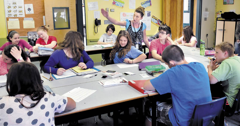 Phillips Elementary School language arts teacher Nicole Levesque works with students on Wednesday. The school recently received an A grade by the Maine Department of Education.