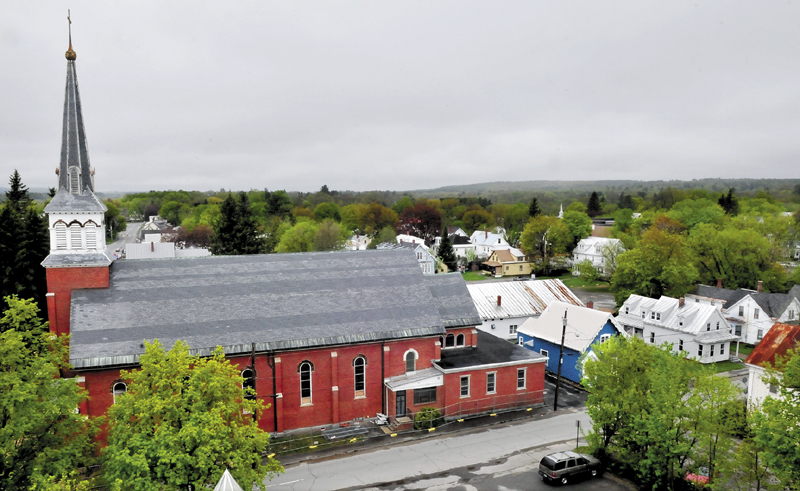 The St. Francis de Sales Catholic Church in Waterville looms over the Waterville neighborhood on Thursday. The church will be torn down this summer to make room for a housing project.