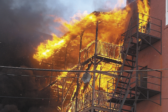 A building in downtown Waterville burns Friday afternoon. The fire on the upper floors of the Main Street building between Silver and Spring streets was reported around 4 p.m.