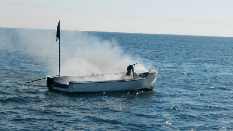 Lobster boat Miss Ellie burns off the coast of Wells on Wednesday. Photo provided by U.S. Coast Guard.