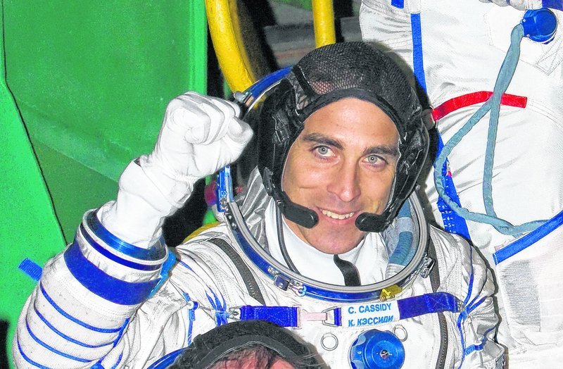 Christopher Cassidy, who grew up in York, pumps his fist before taking off for the International Space Station March 28. Cassidy was part of a hastily planned spacewalk Saturday that repaired a serious ammonia leak on the station.